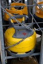 Close-up pressurized gas cylinders in a rack