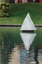 Steel Pyramid sculpture in the park`s pool near Petronas twin towers in Kuala Lumpur, Malaysia Royalty Free Stock Photo