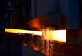 Steel quenching at high temperature in industrial furnace at the workshop of a forge plant. Process of cooling, heat treatmen.