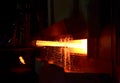 Steel quenching at high temperature in industrial furnace at the workshop of a forge plant. Process of cooling, heat treatmen.