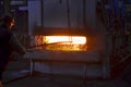 Steel quenching at high temperature in industrial furnace at the workshop of a forge plant. Process of cooling, heat treatmen.