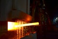 Steel quenching at high temperature in industrial furnace at the workshop of a forge plant. Process of cooling, heat treatmen.