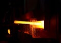 Steel quenching at high temperature in industrial furnace at the workshop of a forge plant. Process of cooling, heat treatmen.
