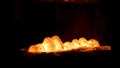 Steel quenching at high temperature in industrial furnace at the workshop of a forge plant. Scene. Process of cooling