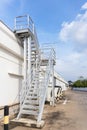 Steel railing roof stairs. Metal staircase to the roof of a modern building. Stairwell fire or emergency exit on wall of building Royalty Free Stock Photo