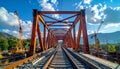Steel Railway Bridge Under Construction with Cranes and Blue Sky Royalty Free Stock Photo