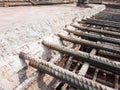 Steel reinforcement bars for reinforced concrete construction have started to rust after being exposed to weather and water vapor.