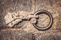 Steel ring and mooring lines in a seaport. Light colored hemp rope on the concrete ground