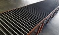 Steel rollers conveyor belt in distribution warehouse. Royalty Free Stock Photo