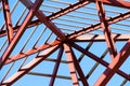 Steel roof structure of home on bright blue sky background , construction site background Royalty Free Stock Photo