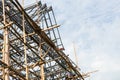 Steel roof truss workers.