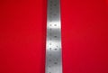 A Steel Ruler on Red Background Royalty Free Stock Photo