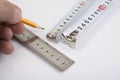 Steel ruler and tape meter with wood pencil on white Royalty Free Stock Photo