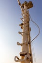 Steel, rusty mast with steps, radar dome and navigation lights on top Royalty Free Stock Photo