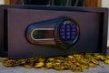 Steel safes box full of coins stack and gold bar Royalty Free Stock Photo