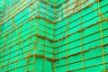 Steel scaffolding with a green curtain