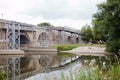 Steel scaffolding on historic stone bridge for renewal