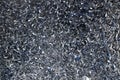 Steel scrap materials recycling. Abstract, background and texture of metal shavings. Aluminum chip waste after machining metal Royalty Free Stock Photo