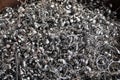 Steel scrap materials recycling. Aluminum chip waste after machining metal parts on a cnc lathe. Closeup twisted spiral steel