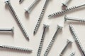 Steel screws, metal screw, screws on a white background view from the top. Royalty Free Stock Photo