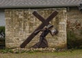 Steel sculpture of Simon of Cyrene carrying the cross for the crucifixion of Jesus Christ