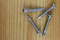 Steel Self-Drilling Screws Flat Head on wooden board Royalty Free Stock Photo