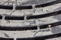 Steel sewer grate.Rough screws. Dark holes. Rusty grunge manhole. Metallic industrial background. Metal texture Royalty Free Stock Photo