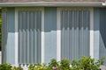 Steel sheets mounted as storm shutters for hurricane protection of house windows. Protective measures before natural Royalty Free Stock Photo