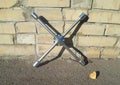 Steel socket wrench stands near a brick wall, auto repair, car tire replacement