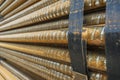 Steel, some round steel bars in the steel bearing outdoor, metal bundled with steel tape, selective focus Royalty Free Stock Photo