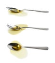 Steel spoon in a puddle of olive oil Royalty Free Stock Photo