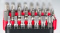 Closeup of metal torx, hexagon or pozidriv screwdrivers toolkits on white blurry background