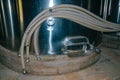 Steel storage tank with pipes and hatch