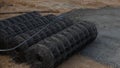 Steel strands of steel panels are laid on the ground for use in construction. Steel Wire stands for Prestressed Concrete PC Strand