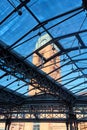The steel structure of the glass roof and the clock tower in the old brewery Royalty Free Stock Photo