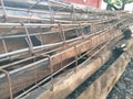 Steel structure for pile work , construction site placed on a long, dirty and dusty wood on a gravel