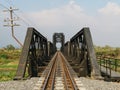 Steel structure of railway bridge, railway rail with vanishing point Royalty Free Stock Photo