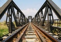 Steel structure of railway bridge, railway rail with vanishing point Royalty Free Stock Photo