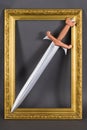 Steel sword with bronze hilt in gold baguette frame