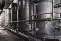 Steel tanks for wine fermentation at a modern winery. Large brewery silos for barley or beer Royalty Free Stock Photo