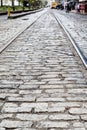 Steel Tracks in Cobblestone Street