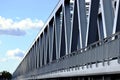 Steel railway bridge truss in closeup in perspective view. blue sky Royalty Free Stock Photo