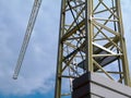 steel truss structure tower crane body and boom under blue sky. Royalty Free Stock Photo