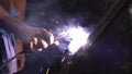 Steel welders with electric welding. No self-defense, unprotected with gloves. Slow motion.