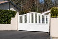 Steel white classic gate aluminum portal with blades of suburban house garden access Royalty Free Stock Photo