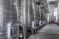 Steel wine tanks for wine fermentation at a winery. modern wine factory with large shine tanks for the fermentation Royalty Free Stock Photo