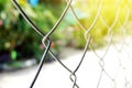 Steel wire fence over sunny light , motivation or freedom concept