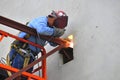 Steel worker welding a joist in place. Royalty Free Stock Photo