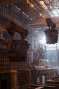 Steelmaking ladles on crane hanging on steel mill