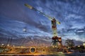 Steelwool spinning in industrial location with crane